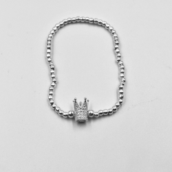 Pulsera elastica de bolitas de plata con una corona picos
