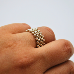 Anillo bolitas elásticas