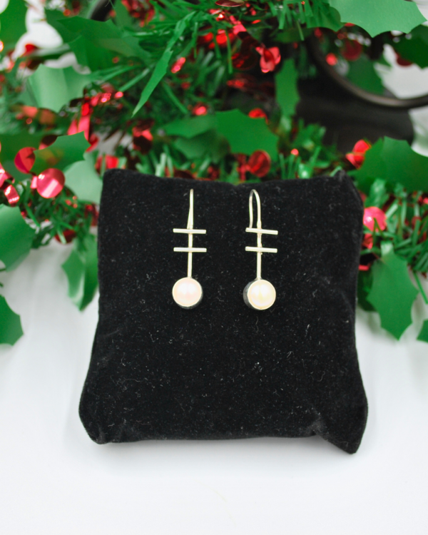 Aretes largos de plata con perla
