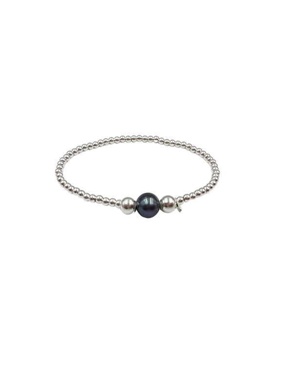 Pulsera elástica con dos esferas de plata y una perla azul en el centro