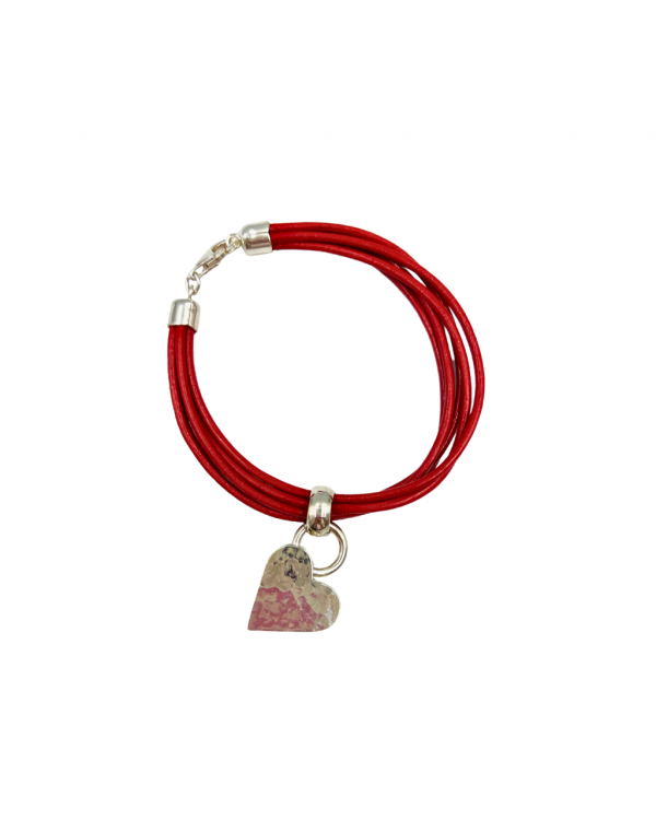 Pulsera de caucho con dije de plata en forma de coraazón