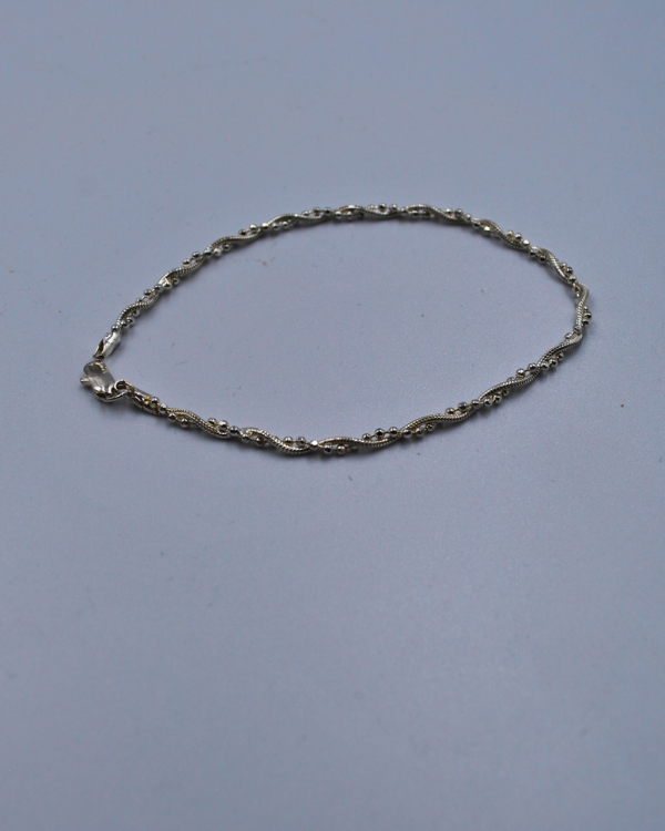 Pulsera torneada con plata lisa