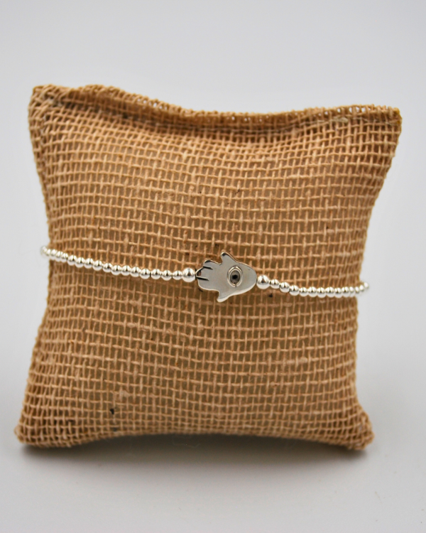 Pulsera elástica de bolitas de plata con ojo turco